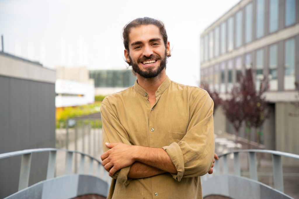 Happy joyful hipster guy posing for camera